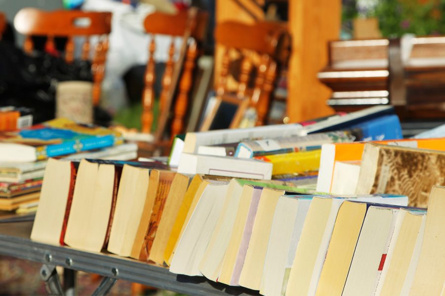books and chairs at a garage sale