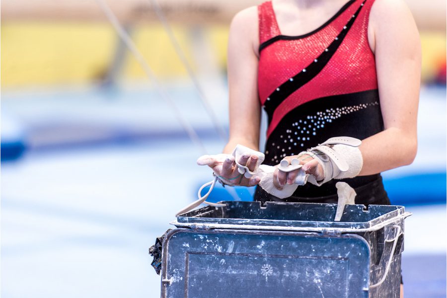 gymnist chalking hands